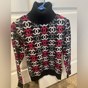 CHANEL Black Turtleneck Sweater with White, Pink & Gray CC Logo Pattern